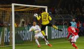 Aubameyang hat-trick leads Dortmund into last eight