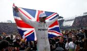 Hamilton collides but wins fourth title