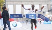 Kipchoge misses record in rainy Berlin triumph