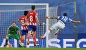 Football briefs: Barca sniff title after Atletico lose