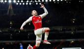 EPL PICS: Ramsey 'tricks' as Arsenal thrash Everton