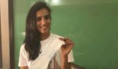 Sindhu, Shastri, Geeta pose with sanitary pad