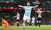 PHOTOS: Aguero treble gets City back on track; United keep up chase