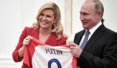 Croatian leader hands Putin soccer shirt before World Cup final