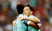 Ozil shines on return as Arsenal crush PSG in Singapore