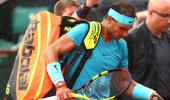 French Open: Nadal trails as rain suspends play