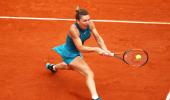 French Open PIX: Halep rallies to advance; Djokovic, Kvitova through