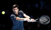 ATP Tour Finals: Djokovic tames Isner as Ronaldo watches