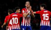 Football Roundup: Atletico go top of La Liga