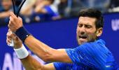 US Open PICS: Djokovic, Federer through; Venus exits