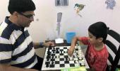 Anand celebrates International Chess Day with son