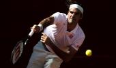 Federer survives match points to beat Monfils