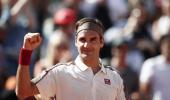 Federer earns milestone; Nadal powers past Goffin