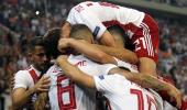 PHOTOS: Olympiakos hold Spurs, City win