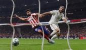 Real Madrid top La Liga after derby draw at Atletico