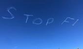 Sydney skywriting says 'STOP F1' amid virus fears