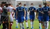 Brazilian team wear masks in protest at having to play