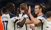 EPL PIX: Spurs up to second; Gunners beat United