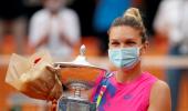 Halep claims Rome title after Pliskova retires