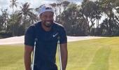 Tiger posts photo of himself on crutches