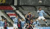 Champions League: City fight back to beat 10-man PSG