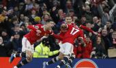 PICS: Manchester Utd edge Palace; Spurs have it easy