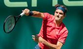 Federer wins on return to grass in Halle