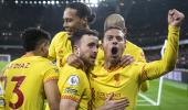 Liverpool beat Arsenal to cut City's lead; Spurs win