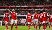 EPL PIX: Arsenal go back on top in style