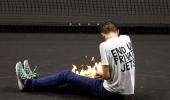 Laver Cup: Protester sets arm on fire on court