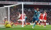 PICS: Arsenal stage late escape, but title hopes hit