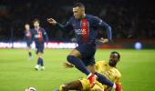 PIX: Mbappe powers PSG to win; Barca survive scare