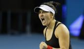 Andreescu battles to comeback win over Muguruza