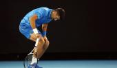 Hamstrung Djokovic taking it one day at a time