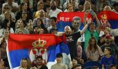 Djokovic's dad seen with fans carrying Russia flags