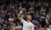 Djokovic survives Wawrinka's late surge