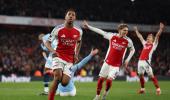 PICS: Arsenal thump City to stay in title race