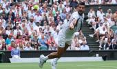 PIX: Djokovic hits century, leads veterans into last 16