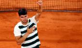 PIX: Alcaraz flattens Paul; Musetti ousts Tiafoe