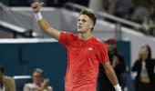 Djokovic protege Mensik beats jeers and Muller to advance