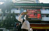 Sensex Falls: Foreign Outflows & Trade Concerns