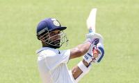 Rahane's century gives India big lead on rain-hit day