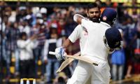 Kohli's 211 and Rahane's 188 propels India to a huge total