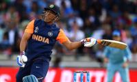 Dhoni criticised but gets Kohli's backing