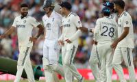 PIX: Rain halts England charge, India live another day