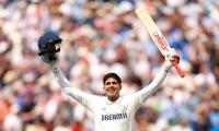 Gill's father 'proud' after double ton but...