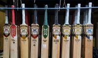What forced MCC to change law on laminated bats?