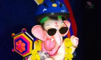 So cute! Ganesha wears a helmet