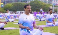 In pix: Adani, Sitharaman strike a yoga pose