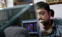 Sensex, Nifty end in red in volatile trade